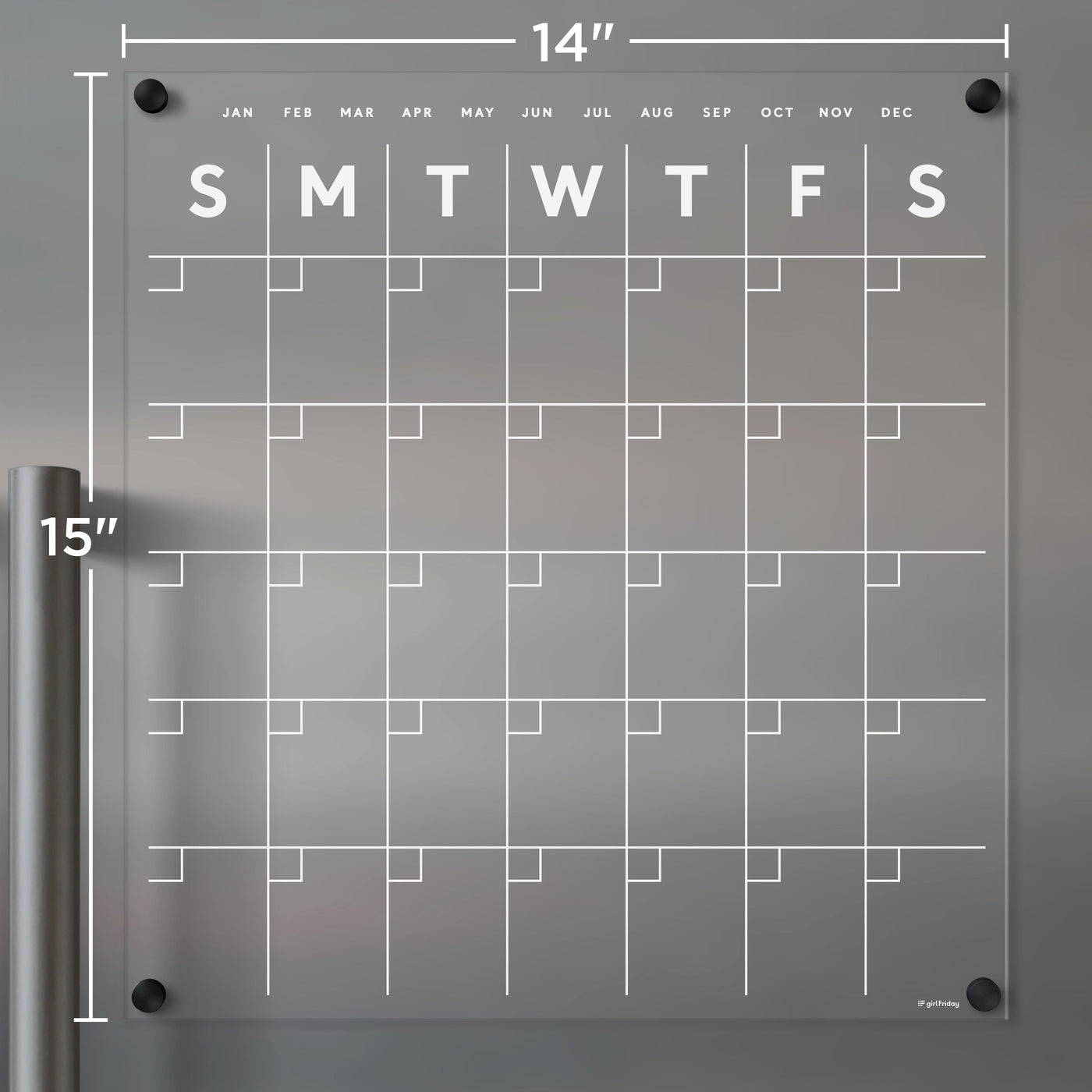 The Clear Acrylic Monthly Fridge Calendar by Girl Friday Shop, with white text, is a transparent 14x15-inch planning tool. Ideal with wet-erase markers, it features days and blank date squares, while months are elegantly listed along the top edge for easy reference.
