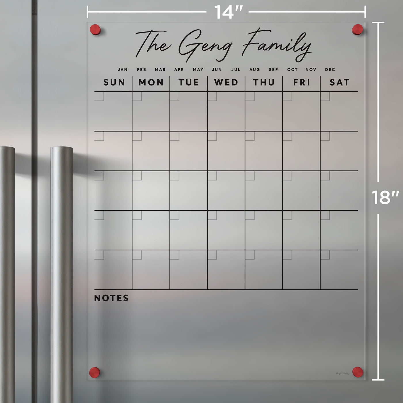 The Clear Acrylic Monthly Magnetic Fridge Calendar by Girl Friday, customizable with a family name in script font, elegantly organizes on silver refrigerators. Measuring 14x18 inches, it includes weekly slots for each day and a notes section, all held securely by red corner magnets for wet-erase use.