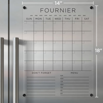 The Girl Friday Acrylic Fridge Calendar offers a sleek, minimalist grid that spans from Sunday to Saturday. Featuring customizable bottom sections, it measures 14x18 inches and uses wet-erase markers for notes. It mounts with metal knobs for a modern touch.