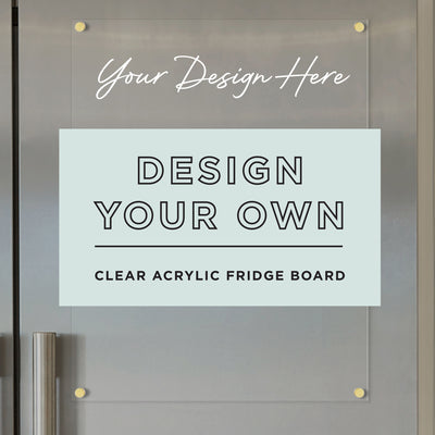 The Girl Friday Acrylic Fridge Board - Design Your Own | Vertical showcases Your Design Here on top. Elegantly mounted on a gray fridge with four gold screws, its perfect for customizing schedules using dry-erase markers.