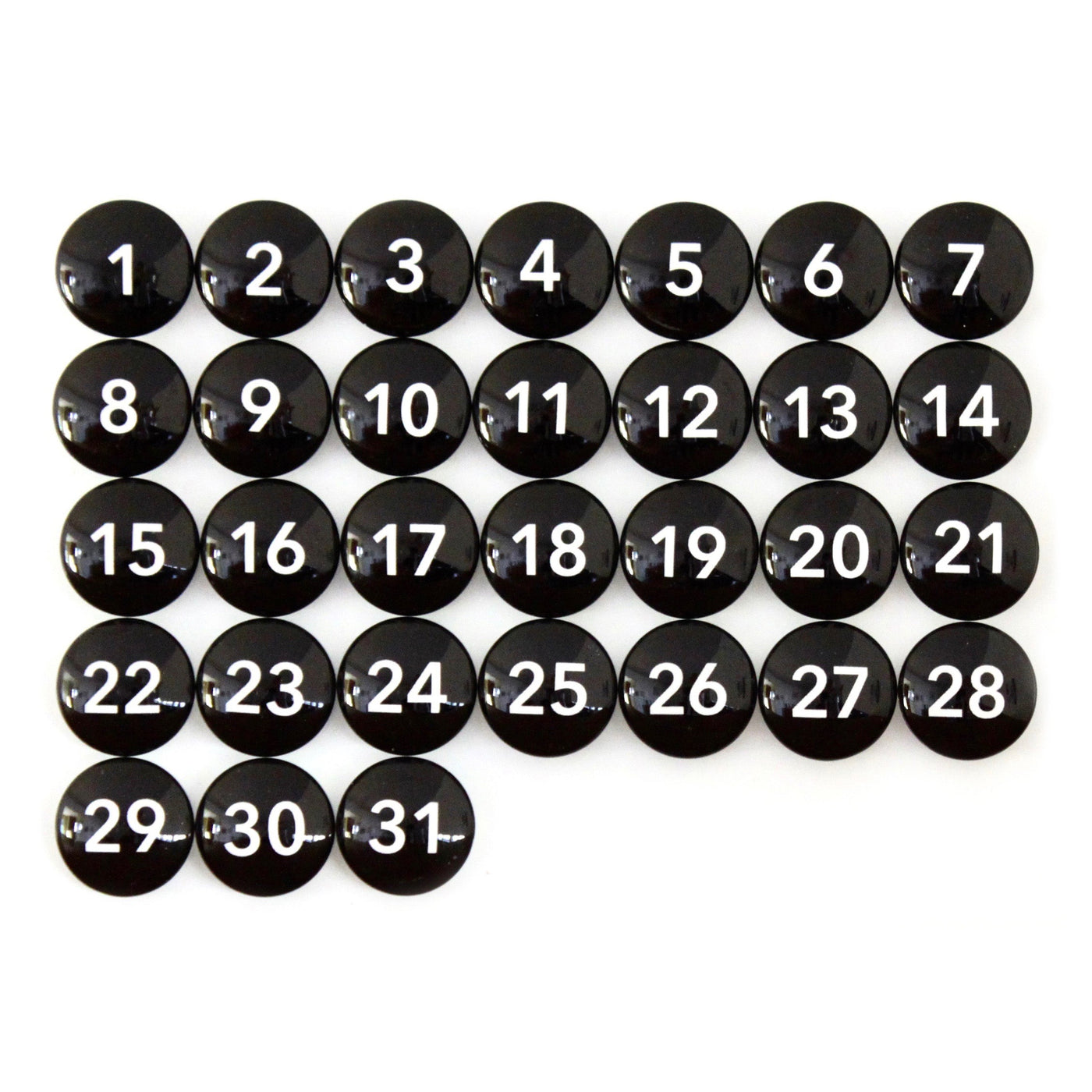 Thirty-one black round buttons are arranged like a chalkboard menu calendar, with each displaying a white number from 1 to 31. (9 X 24 Framed Weekly Chalkboard Calendar #920 by CalendarGirlCompany).