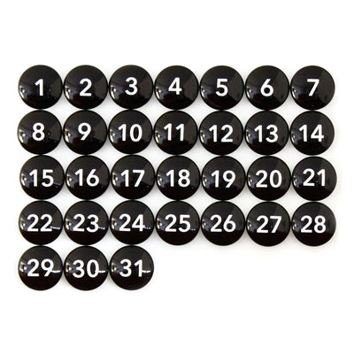 Thirty-one black round buttons are arranged like a chalkboard menu calendar, with each displaying a white number from 1 to 31. (9 X 24 Framed Weekly Chalkboard Calendar #920 by CalendarGirlCompany).