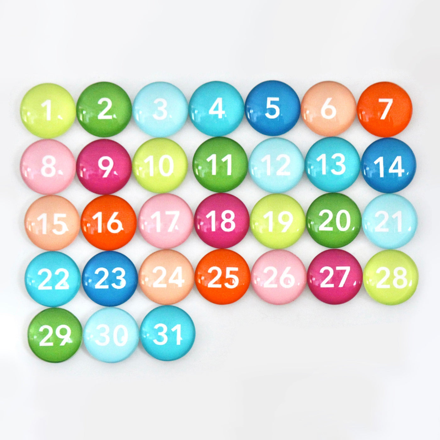The CalendarGirlCompany #920 Weekly Chalkboard Calendar features colorful buttons in vibrant green, red, blue, pink, and orange with white numbers from 1 to 31 arranged in four rows.
