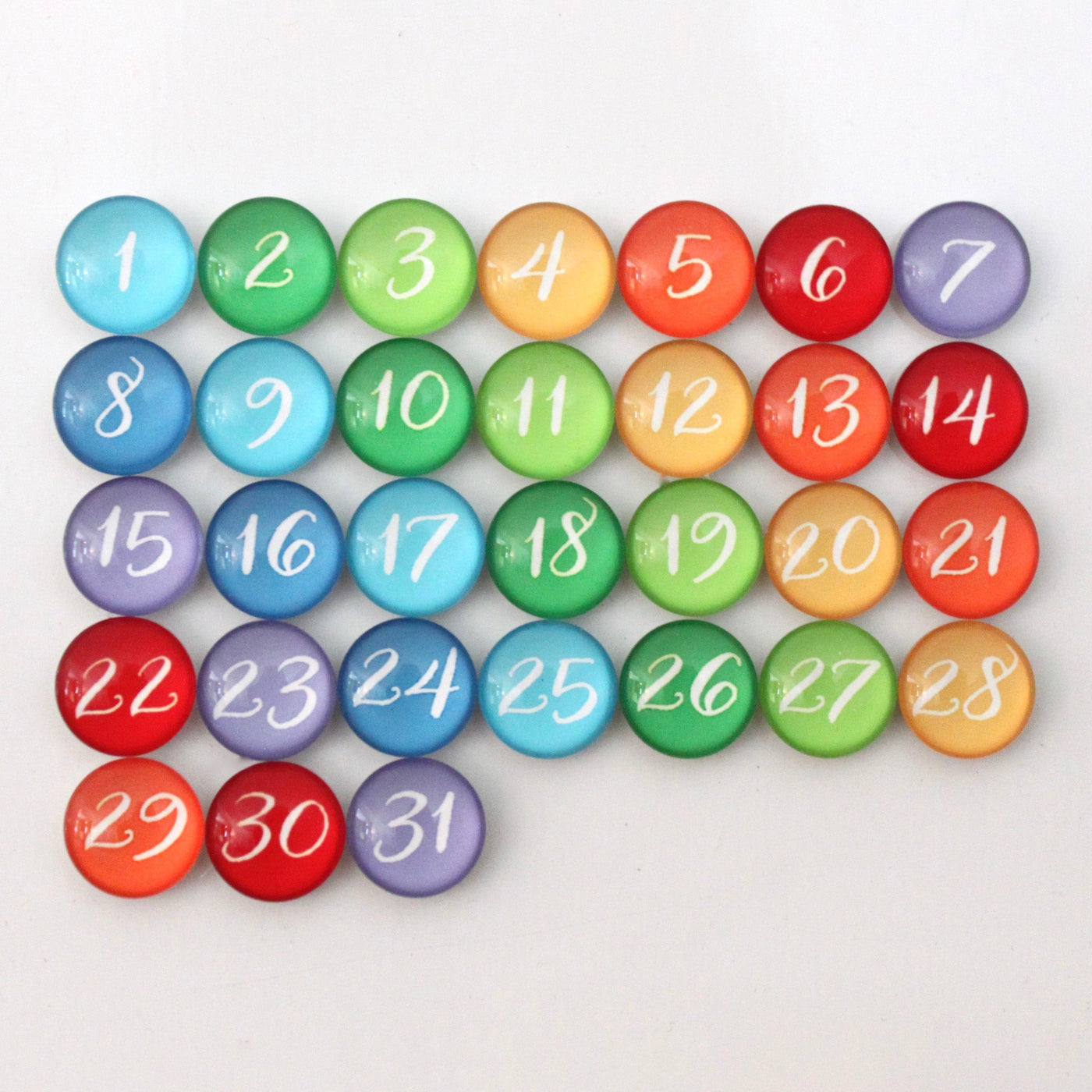 The CalendarGirlCompanys 9 X 24 Framed Weekly Chalkboard Calendar features circular magnets numbered 1 to 31 in vibrant hues of blue, green, orange, red, and purple on a plain background. Compatible with chalk ink markers for seamless monthly planning.