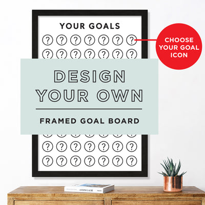 The Framed Goal Chart by Girl Friday Shop features a premium acrylic surface with question mark icons. A red label reads Choose Your Goal Icon. A small plant sits below this sales tracker on the wooden shelf, inviting you to design your own icons.