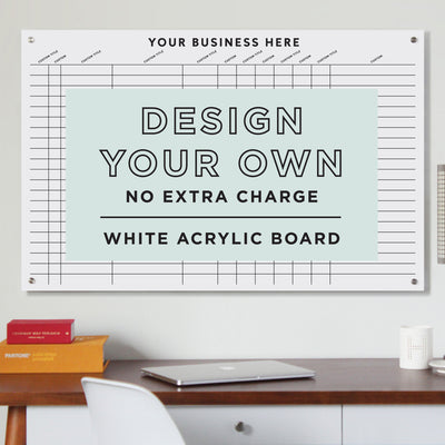 The Girl Friday White Acrylic Floating Board | Design Your Own | Horizontal is a customizable whiteboard with a grid layout, perfect for personal or business branding. It features the text Design Your Own No Extra Charge above a desk with office supplies.