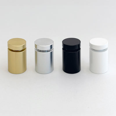 Four Clear Acrylic Monthly Wall Calendars by Girl Friday Shop are arranged in a row on a white background. They boast a sleek and minimalist design with high-quality craftsmanship, available in gold, silver, black, and white finishes, each featuring a matching cap.