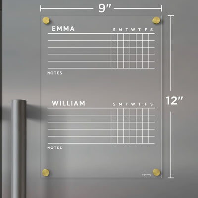 The Girl Friday Acrylic Fridge Chore Chart for 2 children features sections labeled Emma and William, includes week days and notes areas, mounts on metal surfaces using four gold standoffs, measures 9x12 inches, and is perfect for wet-erase markers.