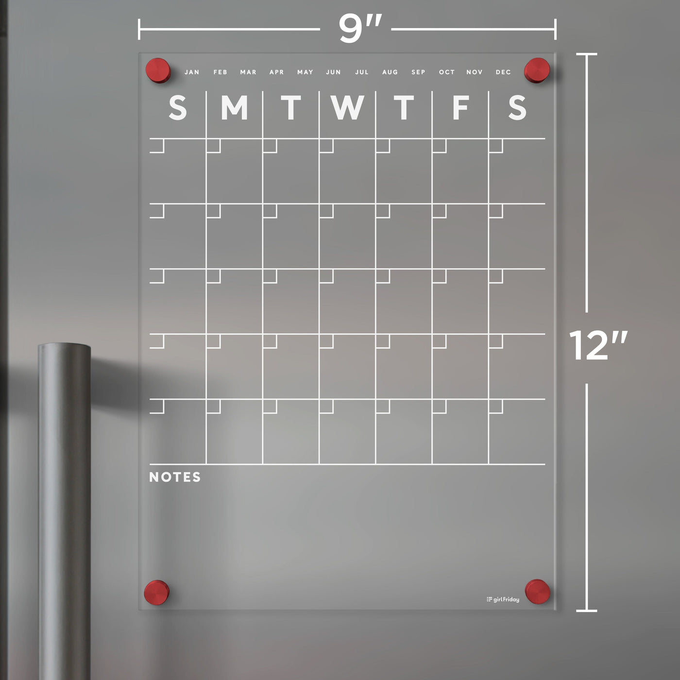 The Girl Friday Acrylic Fridge Calendar | Custom Family Name | White Text features a grid layout with weekdays and months labeled at the top. It measures 9x12 inches, includes red corner magnets and a Notes section for use with dry-erase markers.