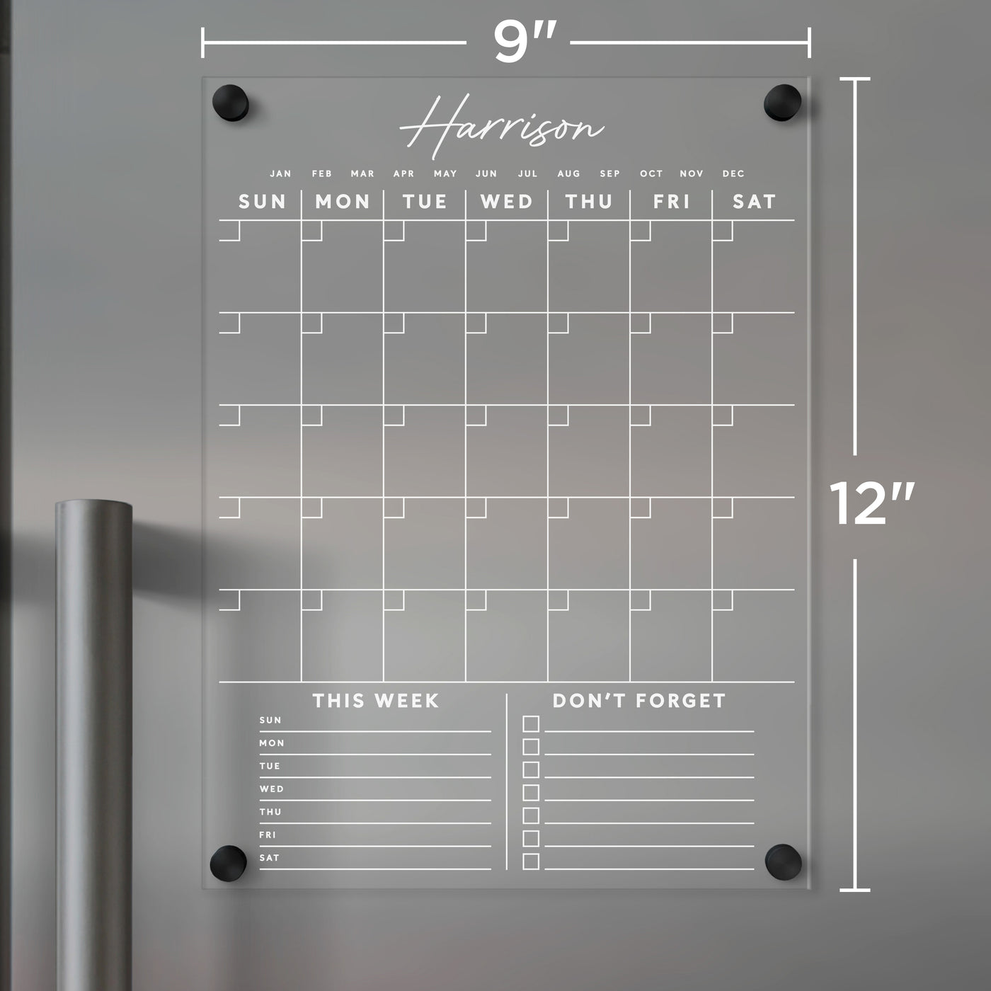 The Girl Friday Clear Acrylic Monthly Fridge Calendar includes customizable bottom sections with white text, featuring columns for each day and spaces for notes labeled This Week and Dont Forget. It measures 9x12 inches and is designed for wet-erase markers.