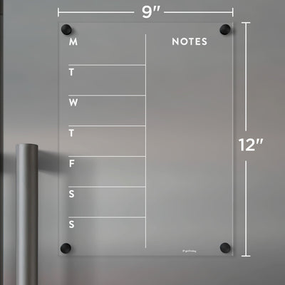 The Girl Friday Clear Acrylic Fridge Calendar features a 9x12 inch weekly plan from Monday to Sunday with NOTES at the top. Its mounted using four black fixtures and works well with wet-erase markers for easy updates.