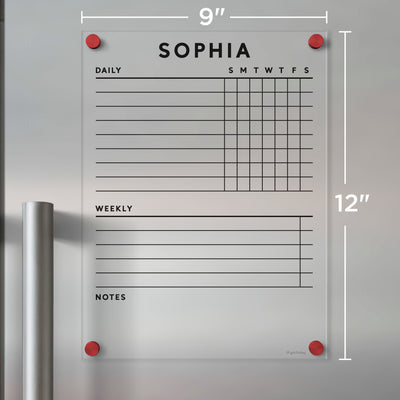 The Girl Friday Acrylic Fridge Chore Chart, personalized with Sophia, serves as a weekly planner with sections for daily tasks, a weekly list, and notes. It uses wet-erase markers and attaches to metallic surfaces with bright red magnets. Dimensions: 9x12 inches.