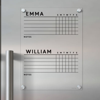 The Girl Friday Acrylic Fridge Chore Chart for 2 children features a grid for daily planning labeled S M T W T F S divided for Emma and William, with a notes section below. Use wet-erase markers to maintain clear, organized plans.