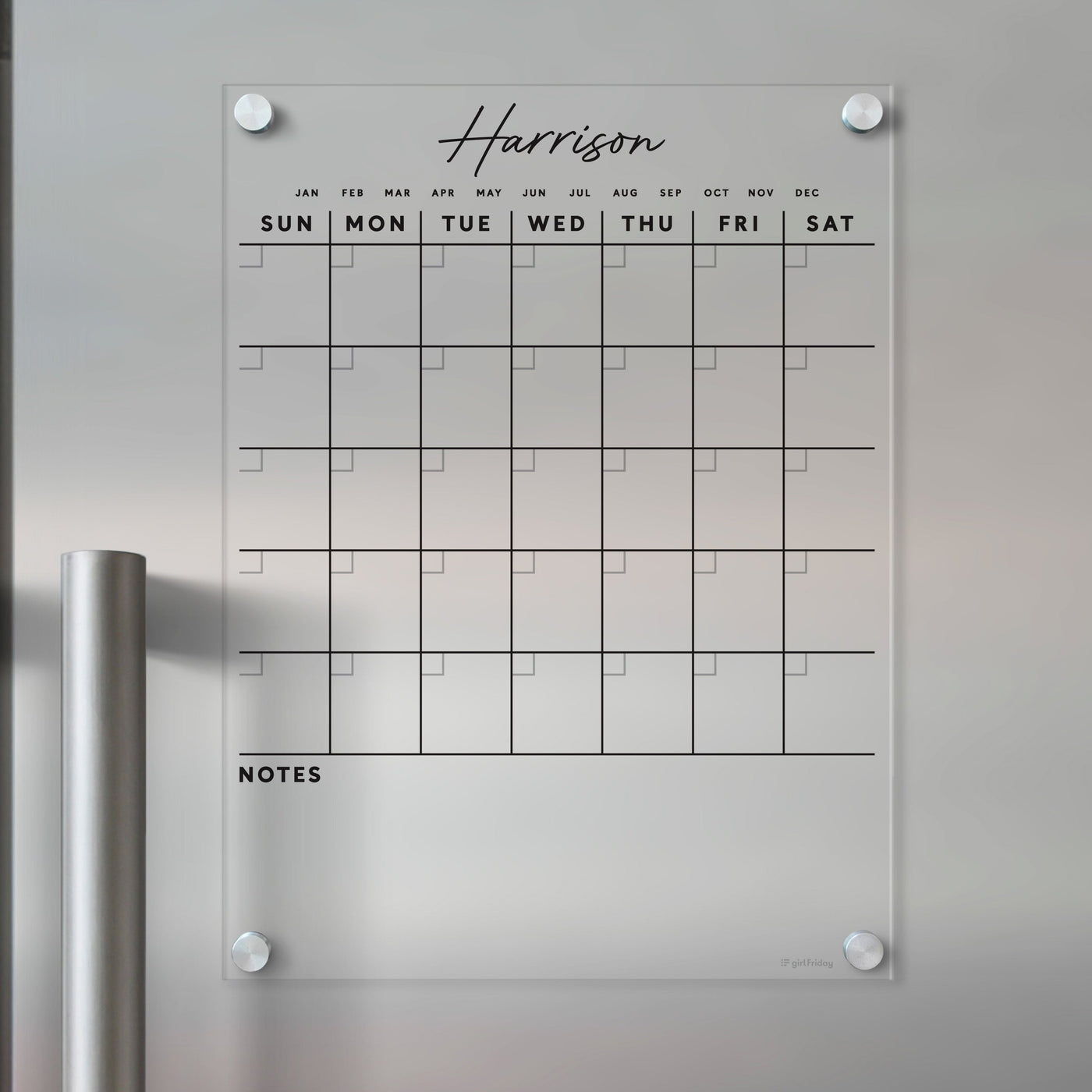 The Girl Friday Clear Acrylic Monthly Calendar for the fridge, customized with Harrison, displays days of the week in bold, includes a Notes section, and is mountable with silver standoffs. Its compatible with wet-erase markers for easy updates.
