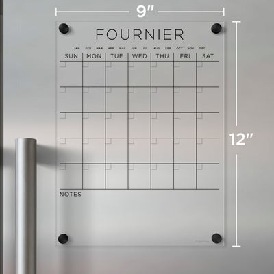 The FOURNIER wall calendar by Girl Friday, crafted from clear acrylic, measures 9x12 inches. Ideal for wet-erase markers, it features a weekday grid and note space at the bottom, offering a sleek solution for organizing your schedule.
