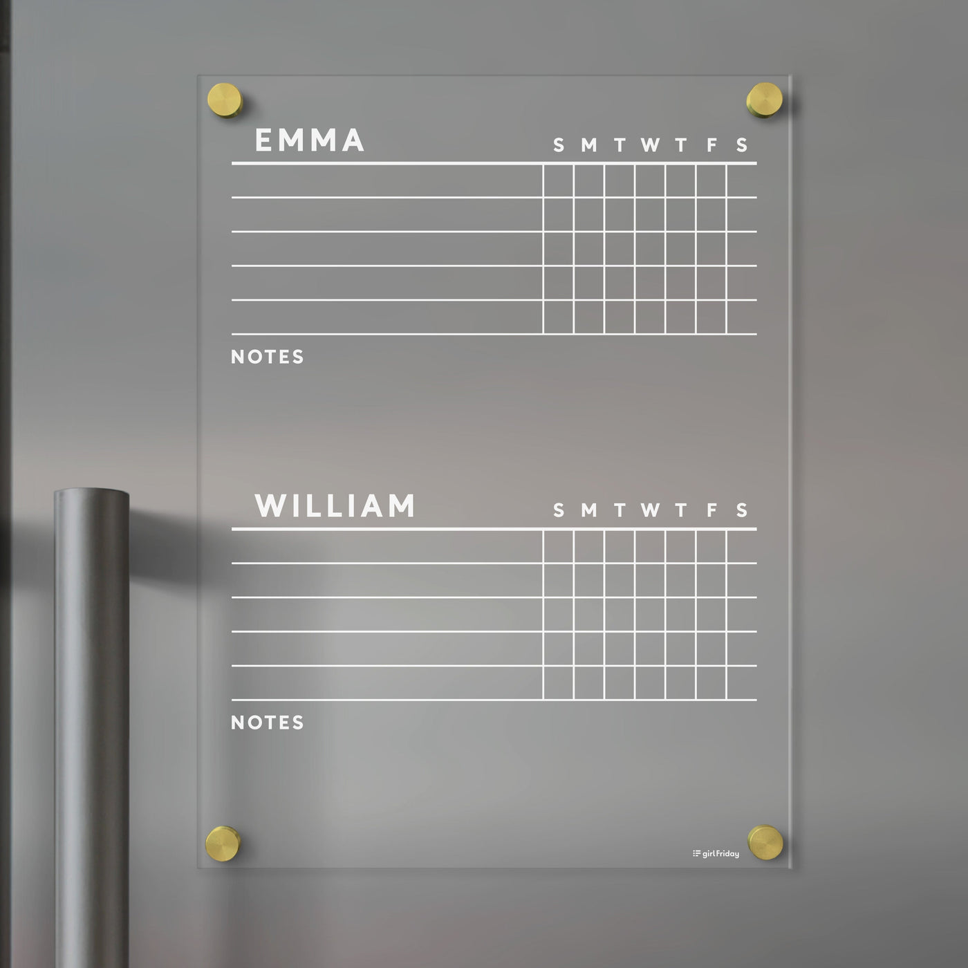 A sleek Girl Friday Acrylic Fridge Chore Chart for 2 children, featuring Emma and William sections with weekly planners and note space, is mounted on a gray wall. Elegantly enhanced by round gold fixtures, its ideal for organizing with wet-erase markers.