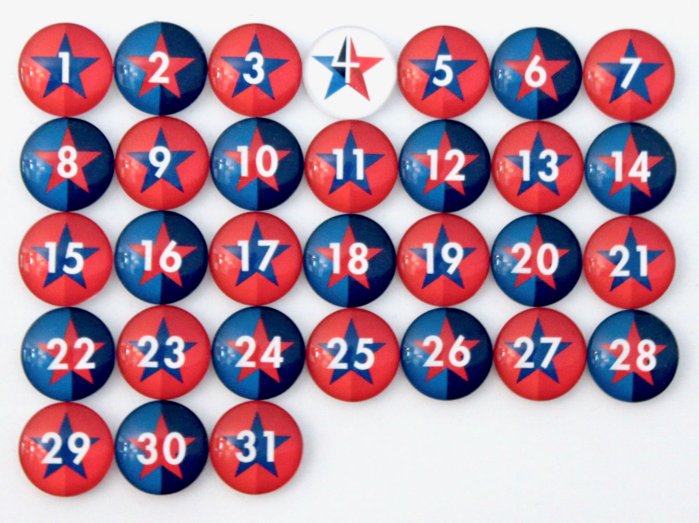 Girl Fridays Number Magnets - Stars - Patriotic Independence Day - 4th of July! feature a grid with numbers 1 to 31, each adorned with a red and blue star design and a white number, resembling a festive July calendar. The number 7 magnet uniquely stands out with its white background.