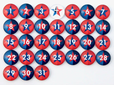 Girl Fridays Number Magnets - Stars - Patriotic Independence Day - 4th of July! feature a grid with numbers 1 to 31, each adorned with a red and blue star design and a white number, resembling a festive July calendar. The number 7 magnet uniquely stands out with its white background.