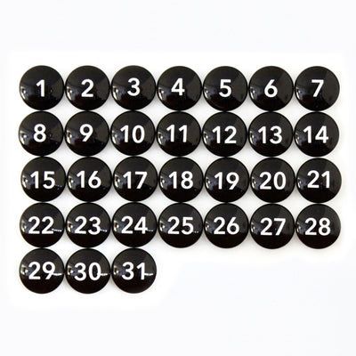 A sleek 24 x 18 framed whiteboard calendar from CalendarGirlCompany (#18203) with round black buttons numbered 1 to 31 in white, arranged in a grid.