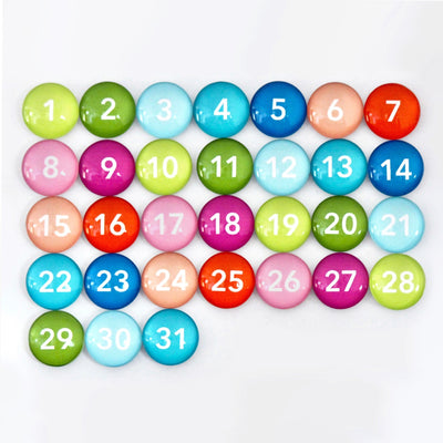 The CalendarGirlCompanys 24 x 36 LARGE VERTICAL CHALKBOARD - 24132 features an assortment of colorful round buttons numbered 1 to 31. These buttons in green, blue, pink, red, orange, and purple can be arranged with chalk ink markers for personalized planning.