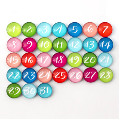 CalendarGirlCompanys 24 x 36 Large Vertical Chalkboard displays a vibrant calendar with colorful round magnets numbered 1 to 31 in green, blue, pink, red, and orange. Neatly arranged in four rows against a white background, it allows easy organization using chalk ink markers.