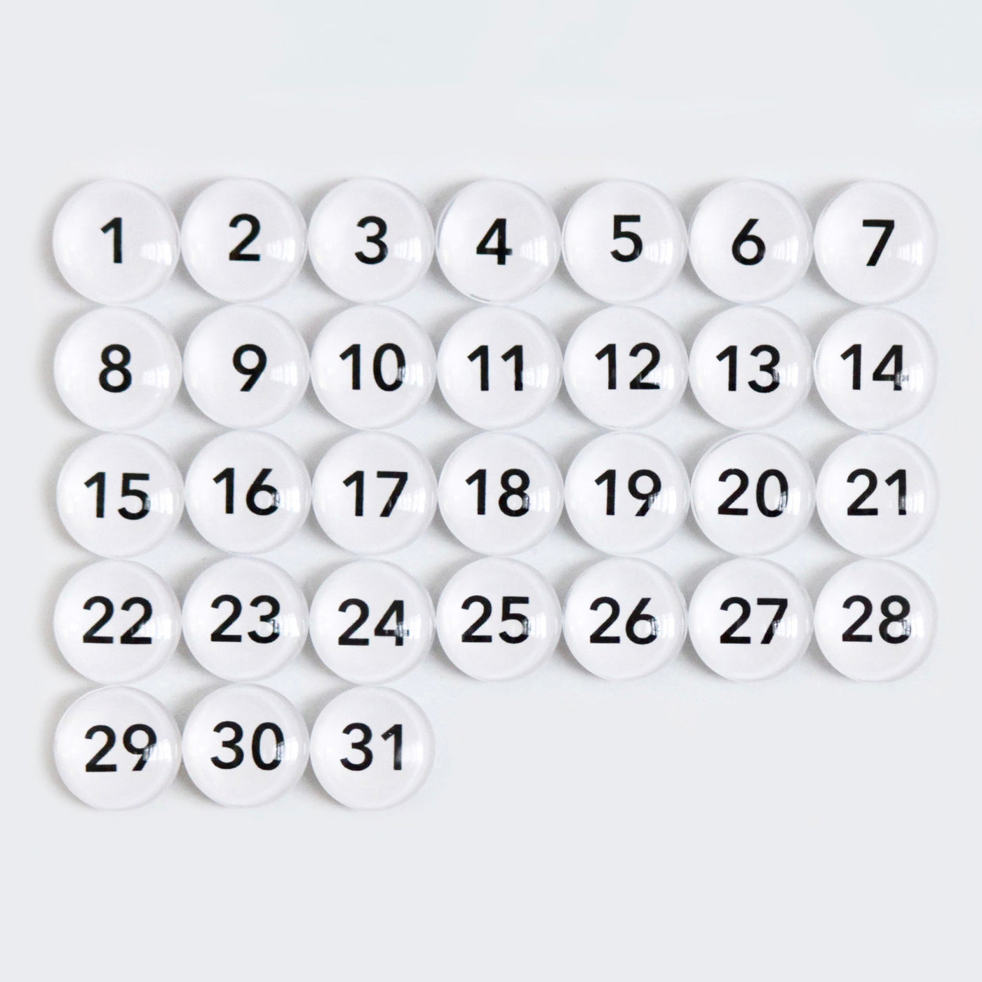 The CalendarGirlCompany 24 x 18 Framed Chalkboard Calendar features thirty-one white spheres numbered from 1 to 31, arranged in a grid pattern, resembling a classic calendar layout. #18210.