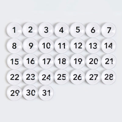 The CalendarGirlCompany 24 x 18 Framed Chalkboard Calendar features thirty-one white spheres numbered from 1 to 31, arranged in a grid pattern, resembling a classic calendar layout. #18210.