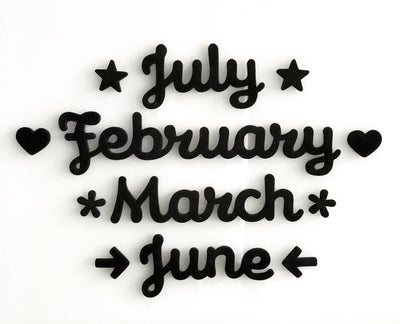 The Magnetic Month Words by Girl Friday Shop feature stylized black text listing July, February, March, and June in a decorative font. Accented with stars and hearts on a plain white background, these elegant designs are ideal for enhancing your calendar accessories.