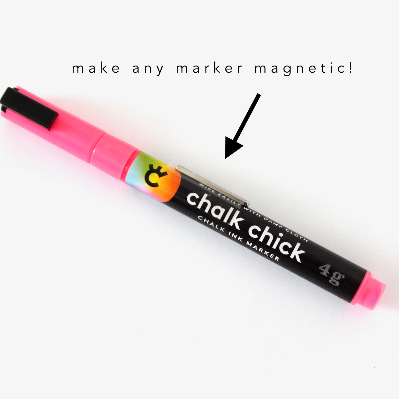 The Make any marker magnetic! by Girl Friday is a pink and black Chalk Chick ink marker with a clip, featuring a thin magnetic strip. A black sans-serif font arrow points to the clip with the text make any marker magnetic!.