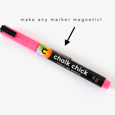 The Make any marker magnetic! by Girl Friday is a pink and black Chalk Chick ink marker with a clip, featuring a thin magnetic strip. A black sans-serif font arrow points to the clip with the text make any marker magnetic!.