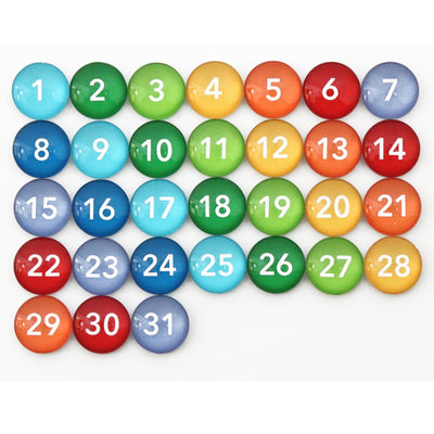 Discover the allure of vibrant colors with Girl Fridays Number Magnets - Rainbow. Featuring numbers 1 to 31 in a striking grid, each magnet beautifully transitions from green to blue, orange, and red—ideal for adding a colorful touch to any space!.